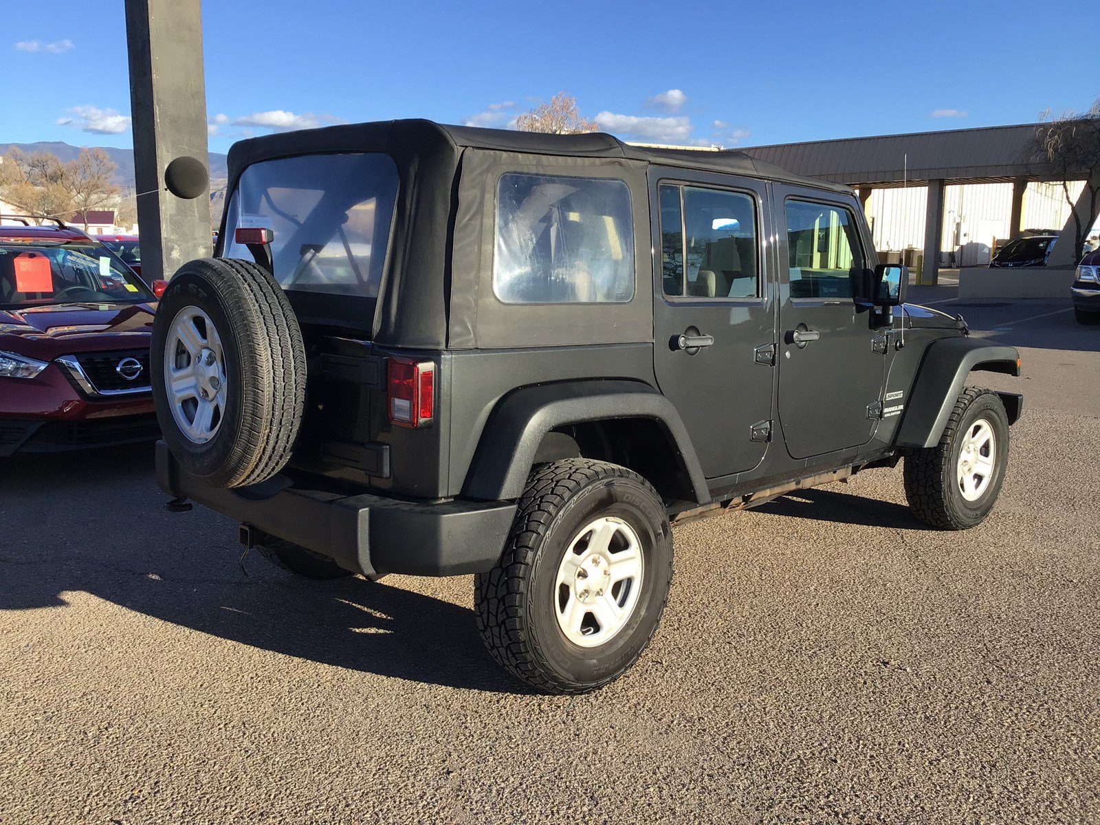 Pre Owned 2010 Jeep Wrangler Unlimited Sport 4wd